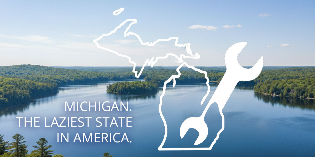 picturesque lake background with an outline of the state of Michigan in the foreground holding a standard wrench. the words "michigan. laziest state in america." are on the image.